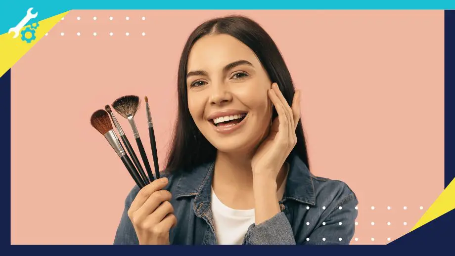 a happy woman holding clean makeup brushes
